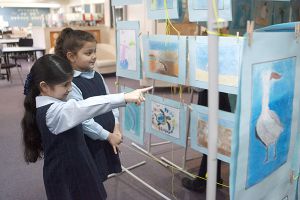 St Josephs Catholic Primary School Belmore - students looking at school artworks